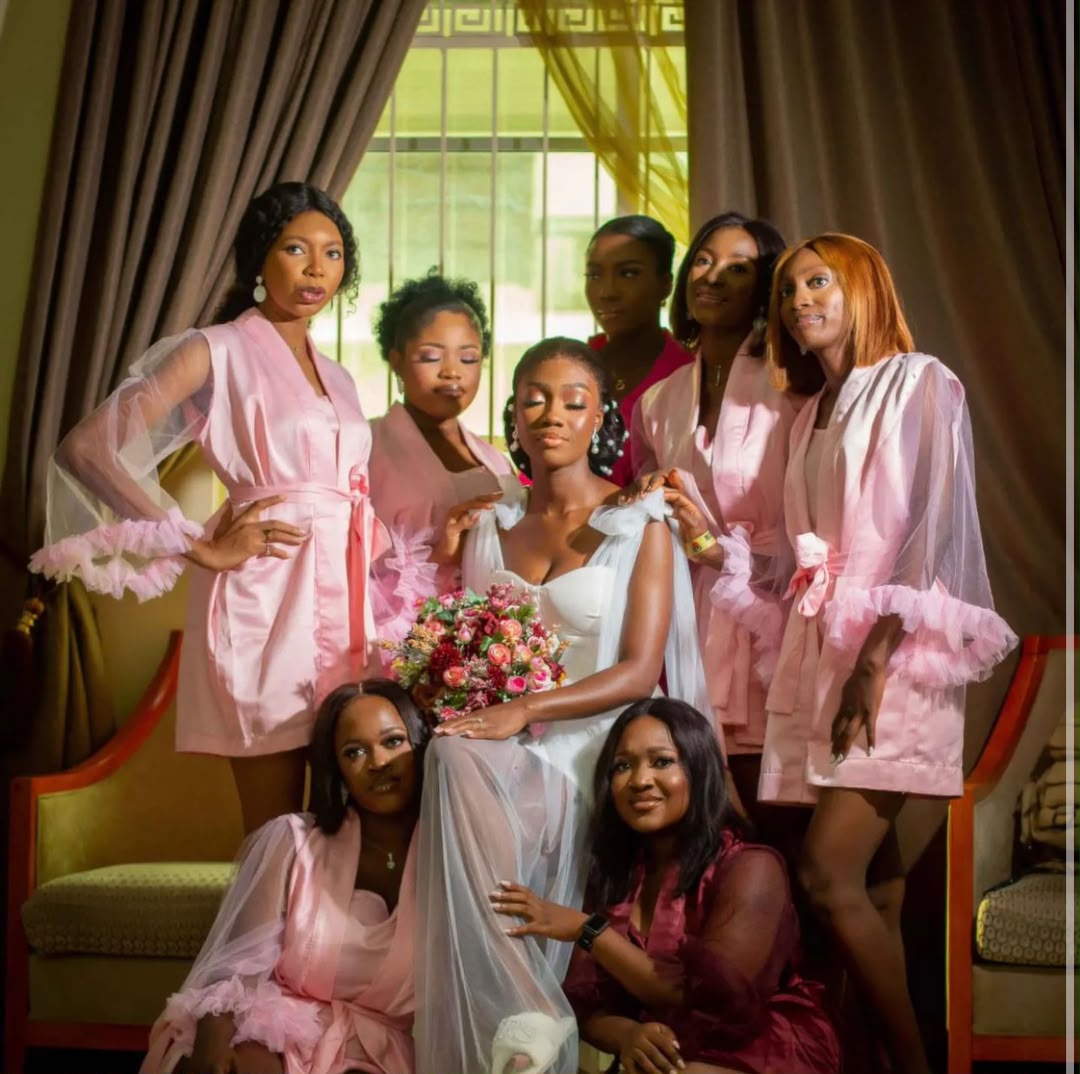 Bride preparing with hair accessories, robes, and beauty items